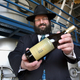 Rabbi Levy Zirkind holds a bottle of kosher Passover table produced by Madera winery DP Enterprises in Madera, California. (Photo: Mark Crosse/Fresno Bee/MCT via Getty Images)